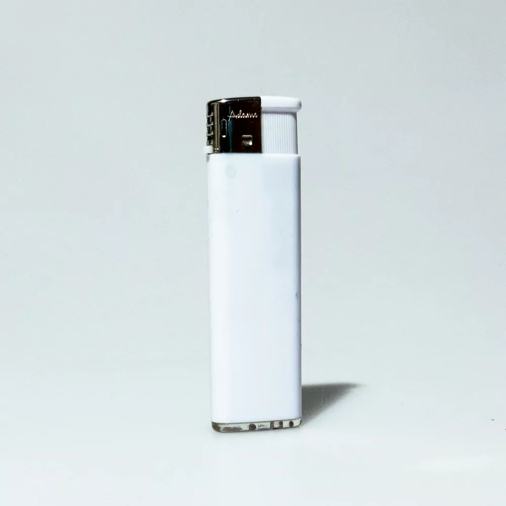 A white disposable lighter standing on a pale grey background