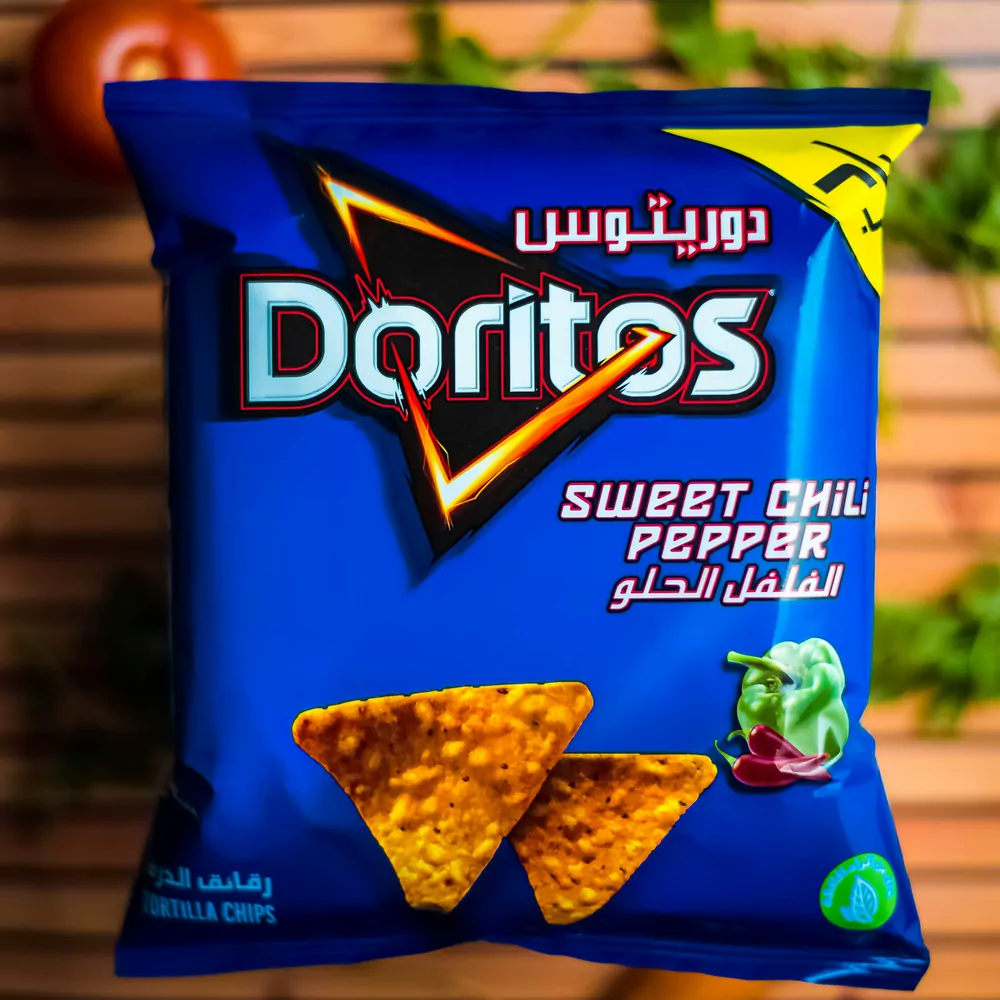 A bag of Doritos Sweet Chili Pepper in imported Arabic and English packaging