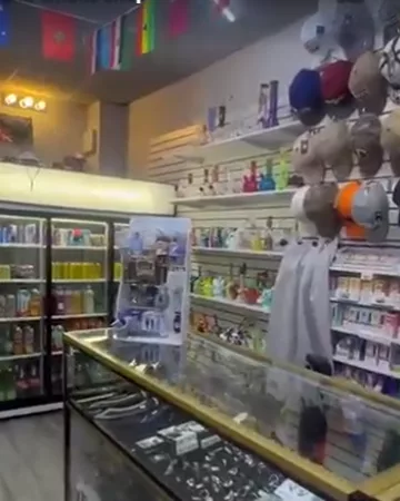 Baseball caps hanging beside the glass counter