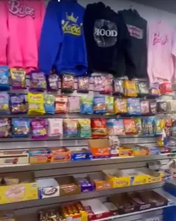 Hoodies hanging above the candy wall